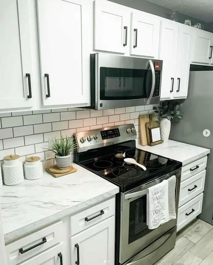 kitchen remodel project with white cabinets and countertop