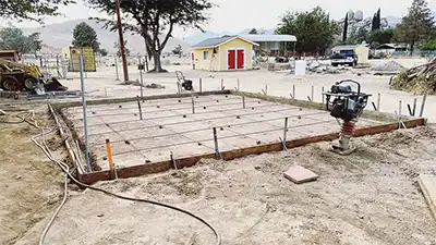 setting up framing to pour concrete for a new landscaping project